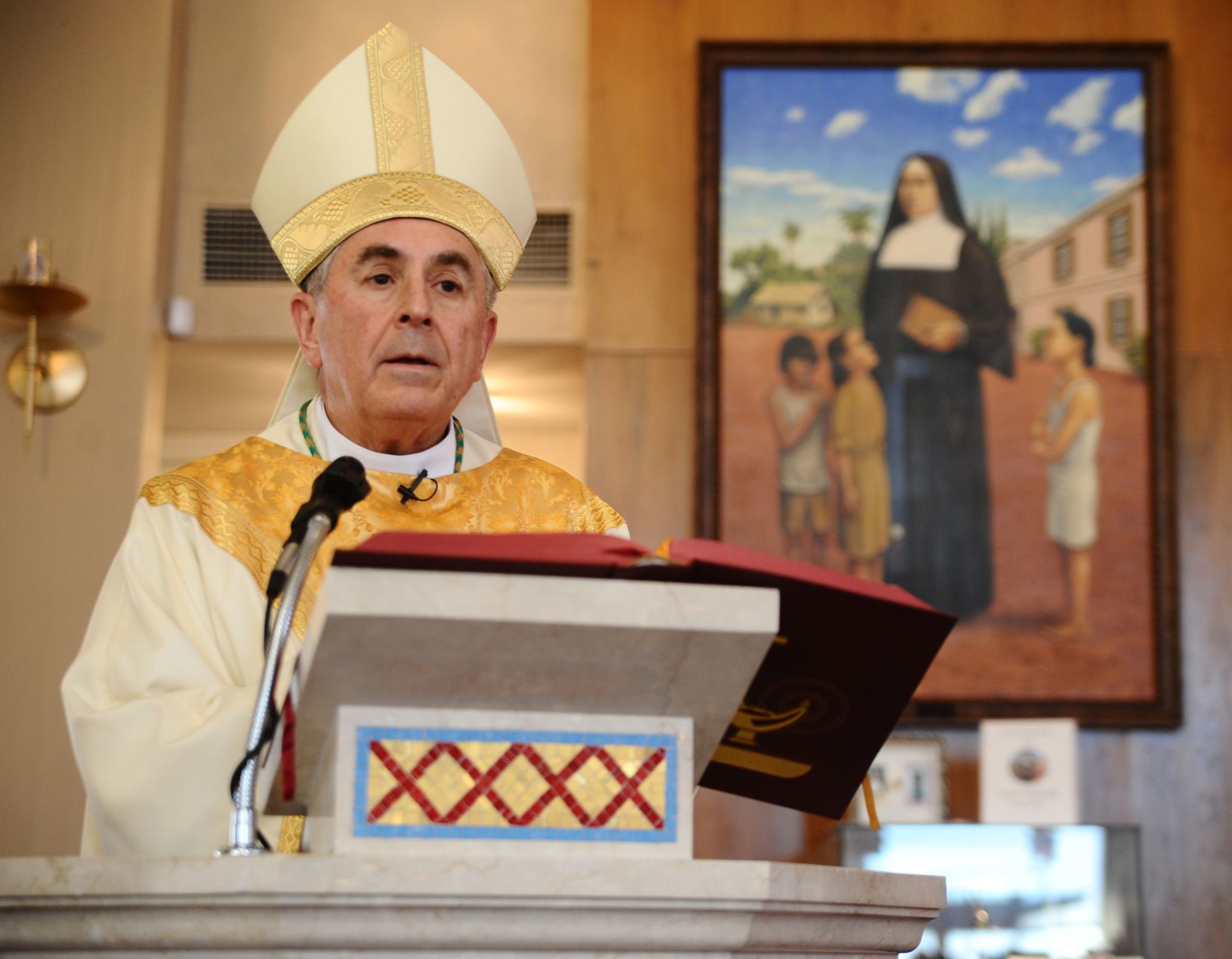 Bishop blesses crucifix